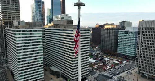 Aerial View of City with American Flag
