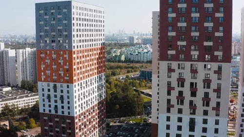 Modern Residential Buildings Rising Above Green Cityscape