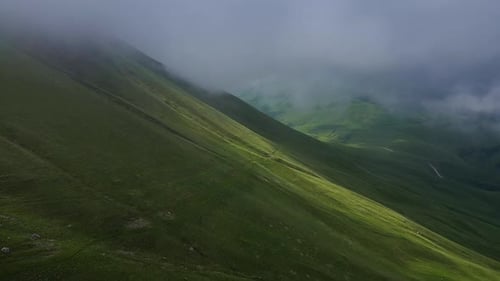 Aerial View of Fogcovered Mountain Slope in Natural Landscape