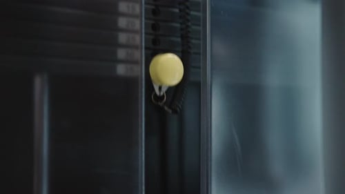 Weight stack move up and down while someone perform pulley row exercise