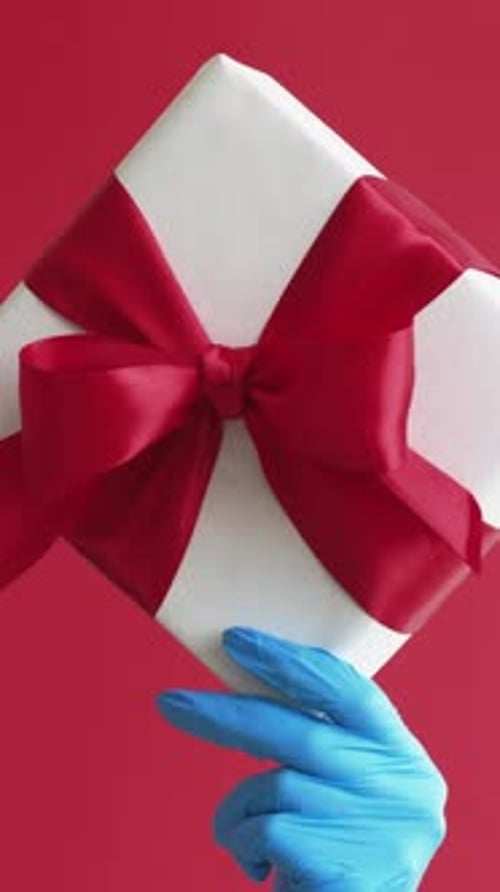 Present Delivered Safely by Gloved Hand