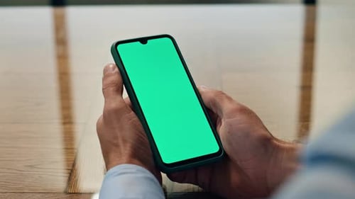 Man Hands Hold Chromakey Mobile Phone in Office Closeup. Unrecognizable Manager Checking