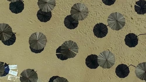 Wooden Sunshade Umbrellas on a Beach