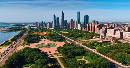 Huge green park territory surrounded by the mighty architecture. Beautiful panorama of metropolis