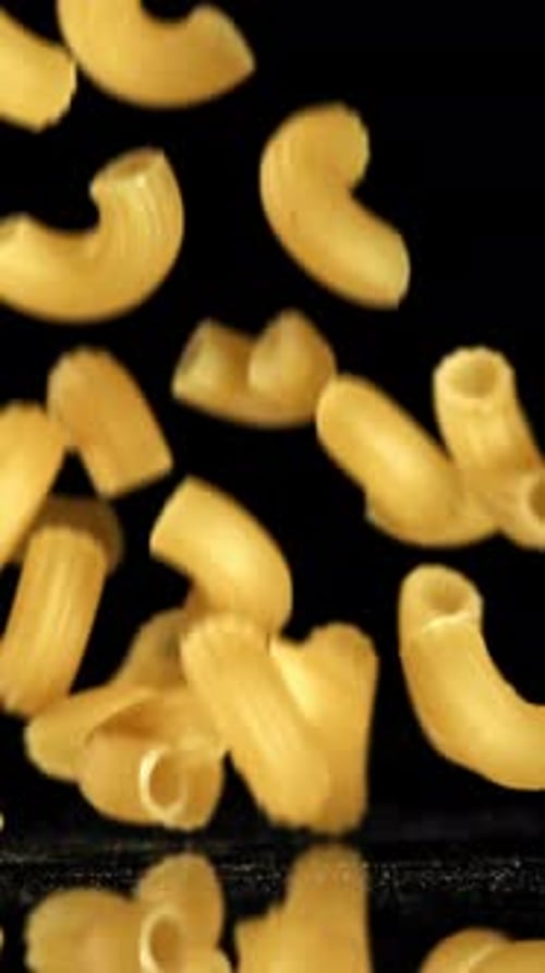 Super Slow Motion Dry Macaroni Pasta Filmed on a Highspeed Camera at 1000 Fps