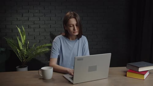 Woman Working at Laptop, Tired