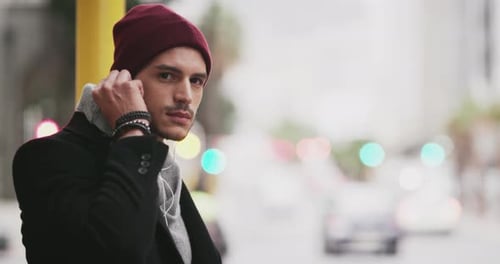 A young handsome man commuting in the city