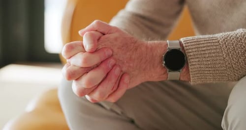 Senior Man with Hands Clasped Wearing Smartwatch
