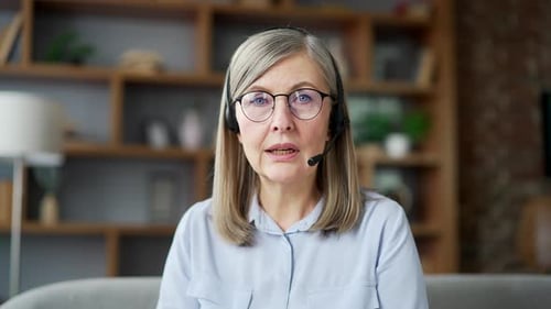 Woman Speaking with Headset in an Office Setting