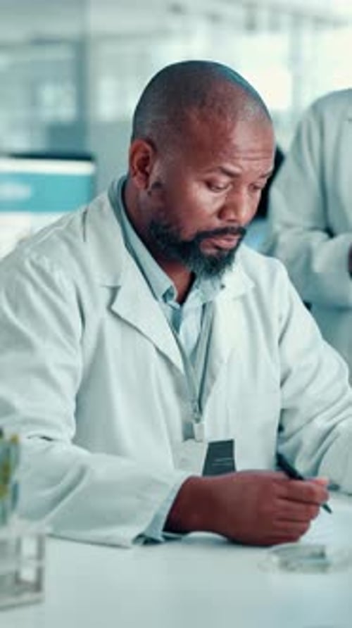 Scientists Collaborating in Modern Medical Laboratory