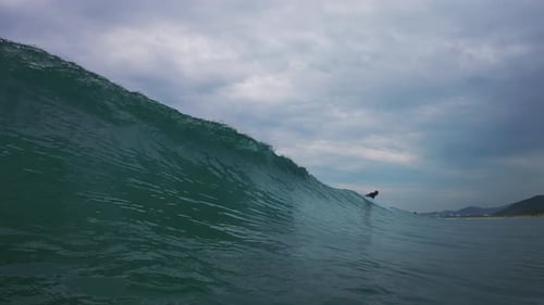 Ocean wave breaks on the shore. Wave rolls and breaks over the coastal area. Underwater camera