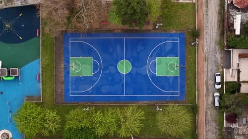 Symmetrical Aerial Shot of Outdoor Basketball Court in Park