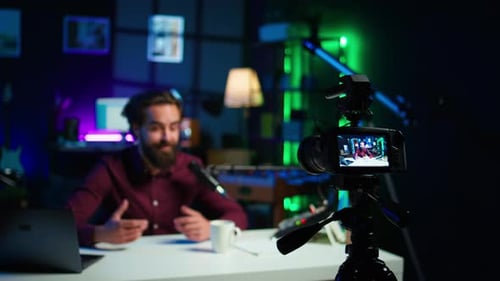 Young Man Creating Video in a Home Studio