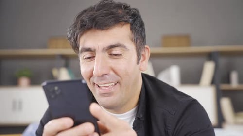 Happy man using phone, message.