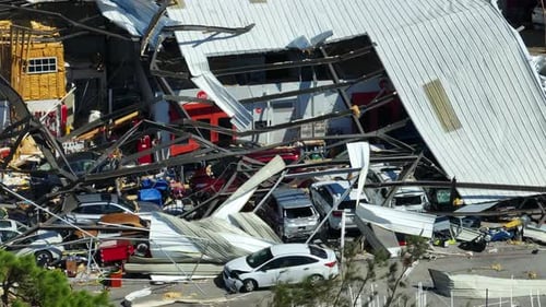 Hurricane Ian Destroyed Industrial Building with Damaged Cars Under Ruins in Florida