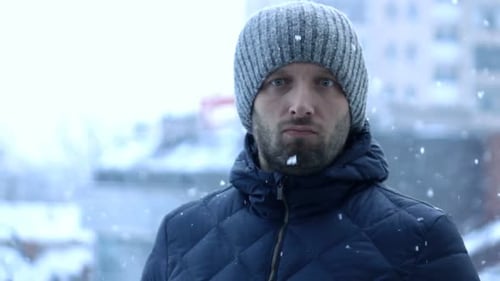 Portrait Of Serious, Young Man In City During Blizzard, Super Slow Motion 240fps