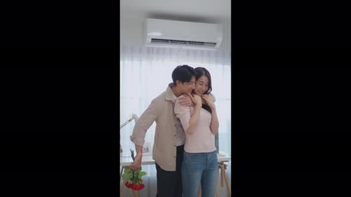 Romantic Couple Embracing with Roses Bouquet Gift