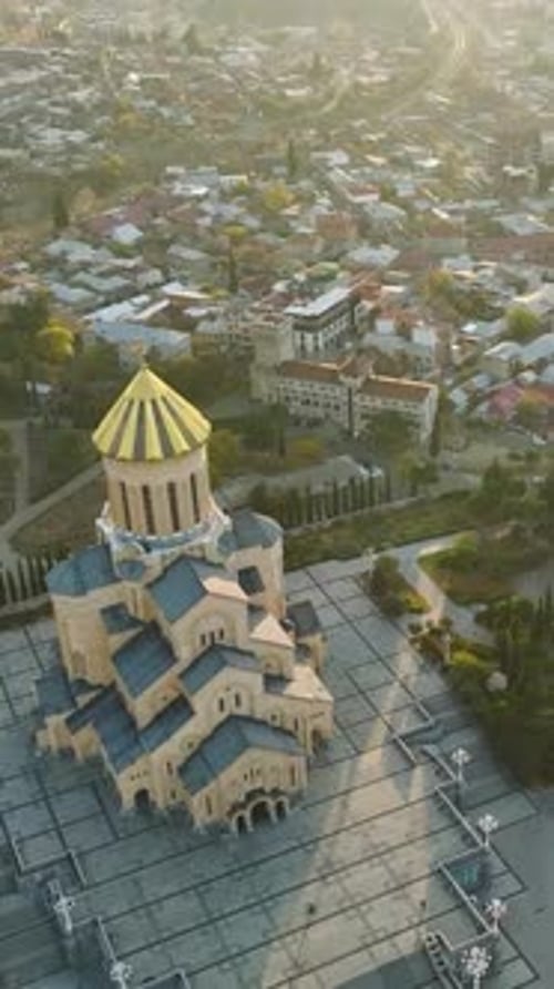 Vertical Video Aerial Sameba Serenity Tbilisi's Stunning Cathedral and Peaceful Grounds