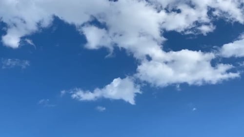 White Clouds Floating in a Bright Blue Sky