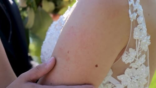 Newlyweds Embracing on a Beautiful Wedding Day