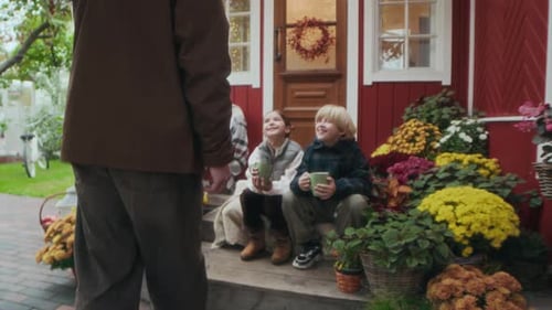 Grandfather Visits Grandchildren on Autumn Porch
