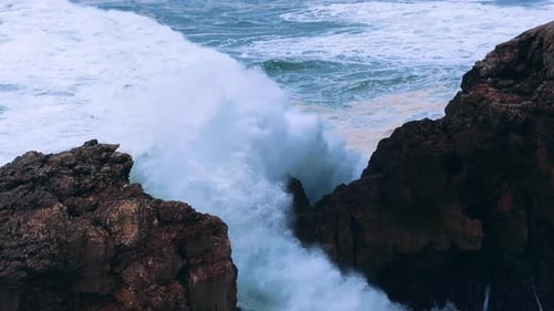 Ocean Waves Crashing Through Narrow Rocky Passage