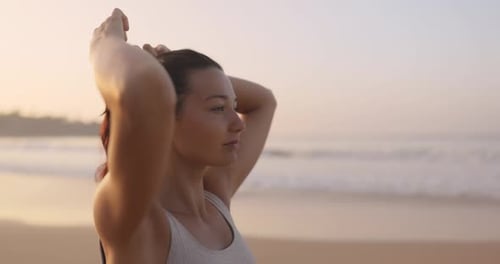 Female Runner Preparation Before Jogging During Outdoor Workout on the Beach in Slow Motion