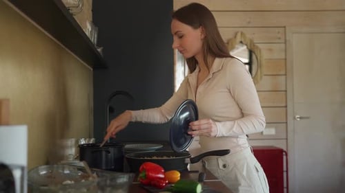 Woman Cooking Healthy Meal in Cozy Kitchen