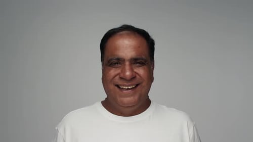 Smiling Man in White T-Shirt Close Up