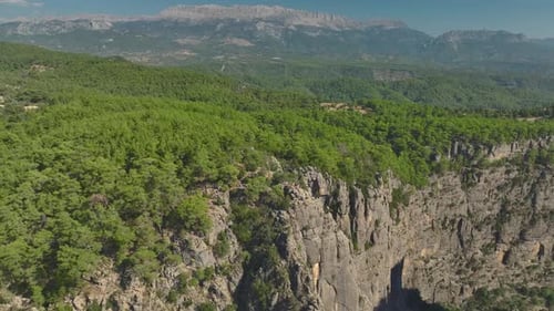 Aerial View Two Friends Posing at the Edge of a Canyon With Incredible Turkish Views