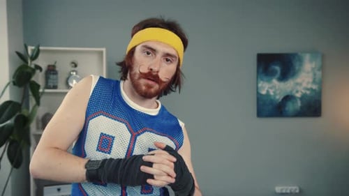 Man Stretching His Wrists Before a Workout