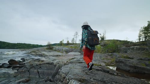 Exploring Natural Landmarks Ecotourism And Backpacking In Nature Back View Of Woman Tourist