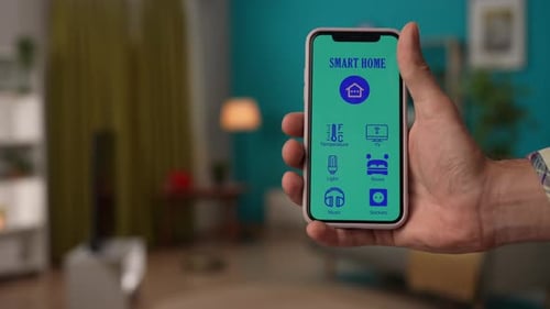 Hand Using Smart Home Control App on Phone