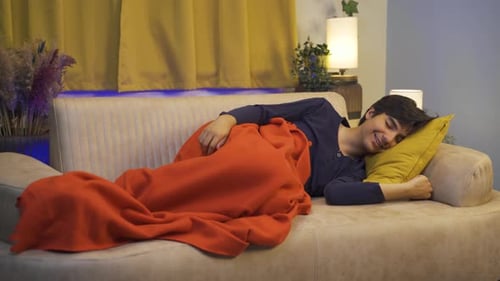 Man smiling while sleeping.