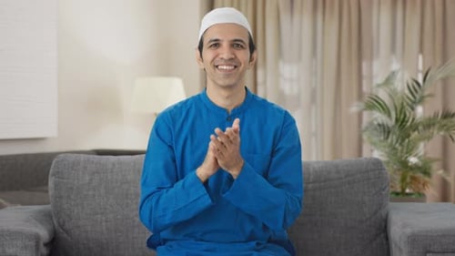 Happy Muslim man clapping and appreciating