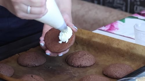 Decorating Chocolate Cookies with White Icing