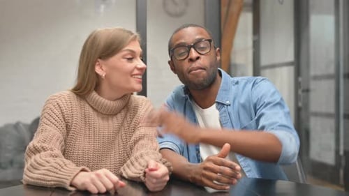 Cheerful Man and Woman Waving and Talking