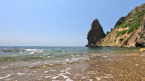 Small Sea Wave Blurred Soft Foamy Waves Washing Golden Sandy Beach and Volcanic Rocky Shores Nobody