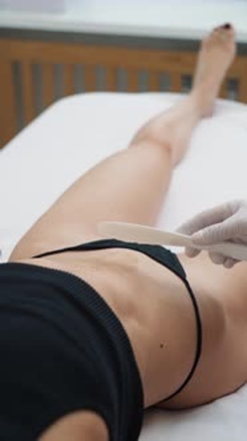 Professional Laser Hair Removal of a Girl Belly Line in a Beauty Clinic