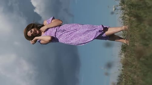 Woman in Dress and Hat Enjoys Rural Nature