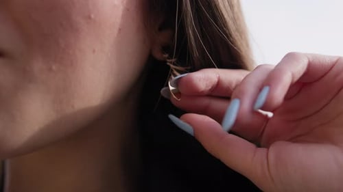 Woman's Stylish Earrings and Hair