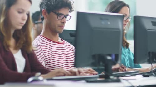 Female Student Typing on Keyboard in Computer Class