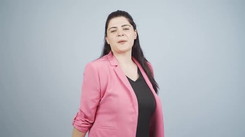 Woman in Pink Blazer Dancing Happily in Studio