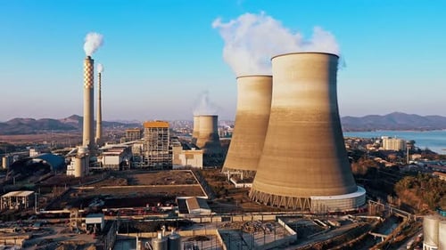 erial view of chimneys of power plant, an industrial district. Modern large thermal power plant