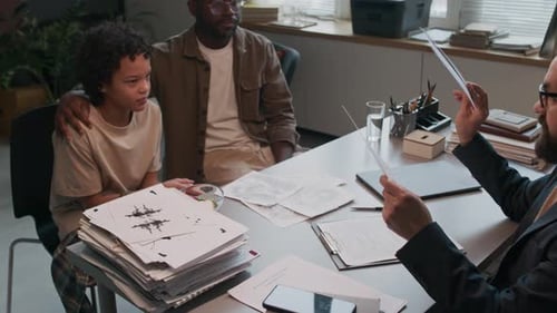 Child Psychologist Evaluating Mood of Schoolboy