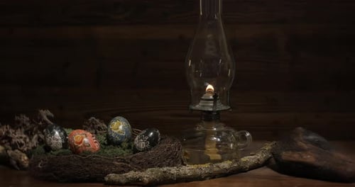 Decorated Easter Eggs and Lit Antique Oil Lamp