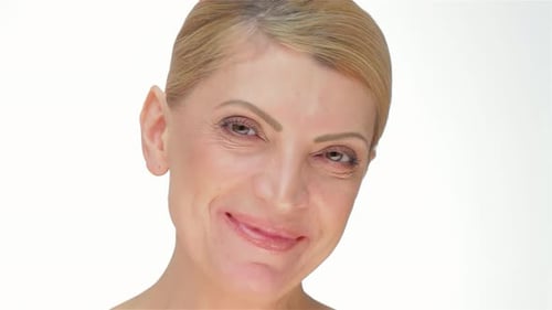 Woman Smiling in Close-Up on White Background