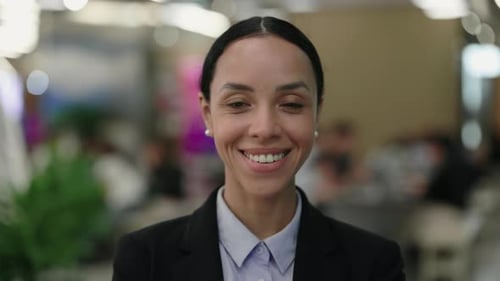 Portrait of the Smiling Confident Female Secretary Standing Posing In the Office