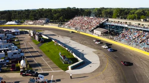 Aerial Footage of a Car Race With Spectators
