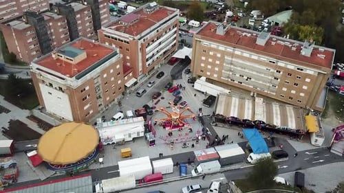 Funfair diversion shot on drone. Amusement park with rollercoaster .